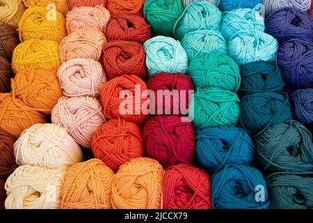 Colorful variation of woolen knitting balls, wool knots, close up full frame as background Banque D'Images