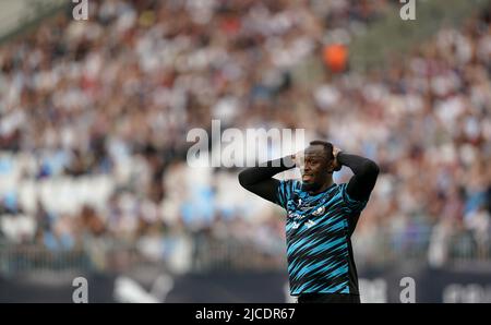 Le reste du monde, Usain Bolt, est une chance manquée lors du match de l'aide au football pour l'UNICEF au stade de Londres, Londres. Date de la photo: Dimanche 12 juin 2022. Banque D'Images