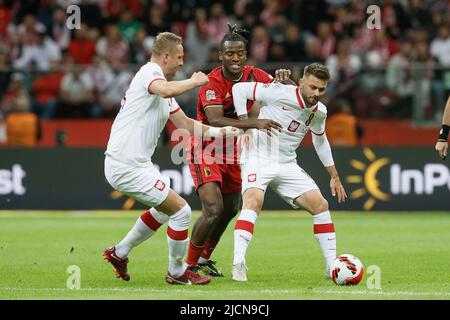 Varsovie, Pologne, 14/06/2022, Michy Batshuayi de Belgique et Karol Linetty de Pologne se battent pour le ballon lors d'un match de football entre la Pologne et l'équipe nationale belge les Red Devils, mardi 14 juin 2022 à Varsovie, Pologne, le quatrième match (sur six) dans la Ligue des Nations A de groupe. BELGA PHOTO BRUNO FAHY Banque D'Images