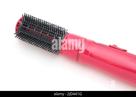 Photo du sèche-cheveux couleur rose isolé sur fond blanc Banque D'Images