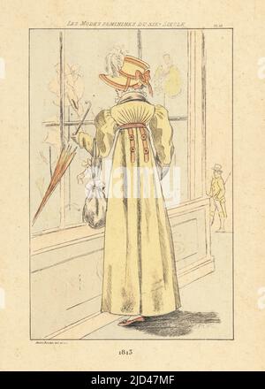 Une femme à la mode pour faire du lèche-vitrine à l'extérieur d'un millinois, Paris, 1813. Elle porte un bonnet, une robe à taille haute avec des manches complètes, tenant un parasol et un sac à cordon ou ridiculiser. Gravure en pointe-seche ou à pointe-séche de couleur main par Henri Boutet des modes Feminines du XIXème siècle Siecle (Fashions féminines du 19th siècle), Ernest Flammarion, Paris, 1902. Boutet (1851-1919) est un artiste, graveur, lithographe et designer français. Banque D'Images