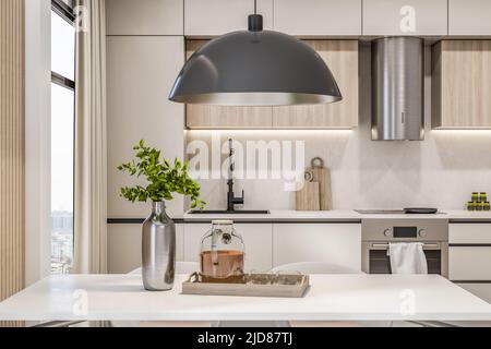 Vue sur l'avant de l'intérieur moderne ECO coin cuisine avec ensemble de cuisine blanc, lampe métallique moderne au-dessus de la table blanche, armoire de cuisine en bois, hotte ronde et Banque D'Images