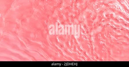 La texture des vagues sur l'eau de rose en plein soleil. Banque D'Images