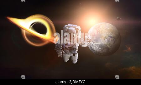 Spaceman dans l'espace avec trou noir et planète Terre. Éléments de cette image fournis par la NASA. Banque D'Images