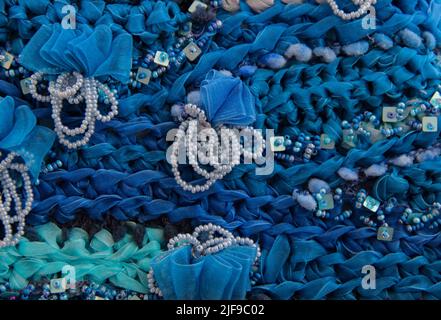 Arrière-plan de broderie complexe. Patchwork. Arrière-plan fait main. Les perles et les rubans font une texture. Banque D'Images