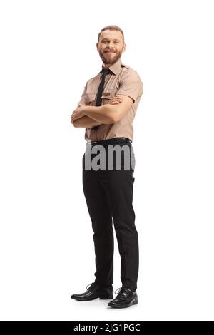Portrait complet d'un garde de sécurité posant avec des bras croisés et souriant isolé sur fond blanc Banque D'Images