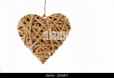 Enseigne en forme de 3D en forme de coeur de paille tressée à la main Banque D'Images