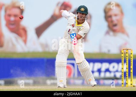 Galle, Sri Lanka. 11th juillet 2022. David Warner d'Australie joue un tir pendant les 4th jours du match de cricket d'essai de 2nd entre le Sri Lanka et l'Australie au stade international de cricket de Galle à Galle, le 11th juillet 2022. Viraj Kothalwala/Alamy Live News Banque D'Images