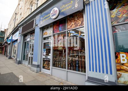 Immigré shisha pipe fumant shop london Road Liverpool Angleterre Royaume-Uni Banque D'Images