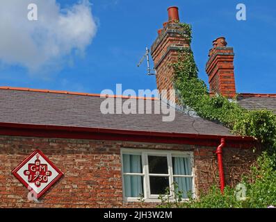 Dunham Massey cottages, avec GM1730 sur le mur extérieur, Dunham, NT, Altrincham, Cheshire, ANGLETERRE, ROYAUME-UNI, WA14 4PE Banque D'Images