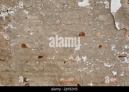 Vieux mur abîmé avec du plâtre usé, fond grince Banque D'Images