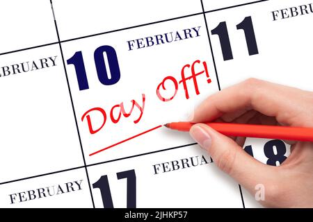 10th jour de février. Écrire du texte à la main JOUR de fin et dessiner une ligne à la date du calendrier 10 février. Concept de planification des vacances. Mois d'hiver, jour de l'an Banque D'Images