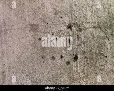 Photo d'arrière-plan parfaite pour les concepteurs d'un beau mur gris unique avec de véritables trous de balle Banque D'Images