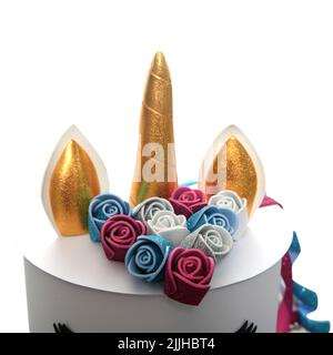 Détails du gâteau au licorne avec glaçage rose sur les gâteaux en papier à galette. Gâteaux en papier cachets, faits à la main. Boîte de cadeaux Banque D'Images