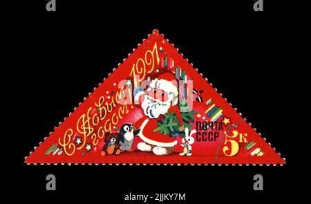 Joyeux Père russe Frost ska Santa Clauss avec arbre vert de vacances pour Noël, vers 1990. Bonne année 1991 comme texte. Cachet post vintage Banque D'Images