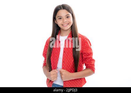 Portrait d'une jeune fille adolescente souriante. Petite fille de 12,13 ans, 14 ans sur fond isolé. Portrait de studio pour enfants. Enfants émotionnels Banque D'Images