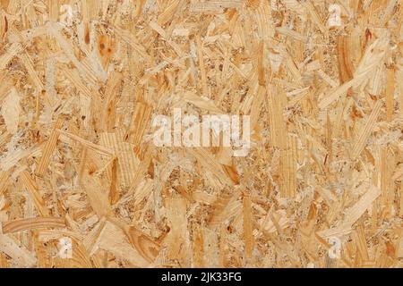 OSB, texture et arrière-plan de panneaux de particules sablés, gros plan. Banque D'Images