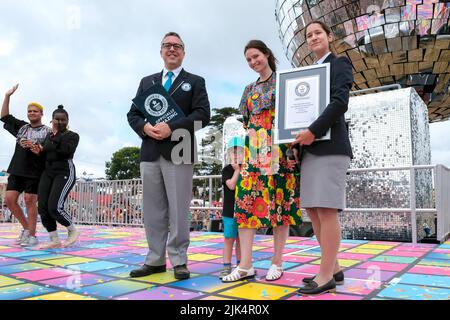 Interpoc The Official Judge of Guinness World Records, Anouk de Timary, holds ...