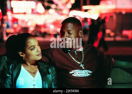 Rosario Dawson & Ray Allen film: He Got Game (USA 1998) personnages: Lala Bonilla & Jesus Shuttlesworth Directeur: Spike Lee 01 mai 1998 **AVERTISSEMENT** cette photographie est à usage éditorial exclusif et est le copyright de TOUCHSTONE et/ou le photographe assigné par la Société de film ou de production et ne peut être reproduite que par des publications dans le cadre de la promotion du film ci-dessus. Un crédit obligatoire pour TOUCHSTONE est requis. Le photographe doit également être crédité lorsqu'il est connu. Aucune utilisation commerciale ne peut être accordée sans l'autorisation écrite de la Société du film. Banque D'Images