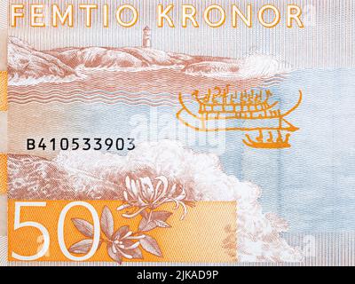 Phare sur la côte de l'argent suédois - Couronne Banque D'Images