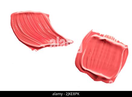 Nuance de beauté corail pastel, soin de la peau et maquillage échantillon de produit cosmétique texture isolée sur fond blanc, taches de maquillage, taches de cosmétiques crème ou Banque D'Images