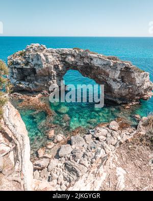 A beautiful view of the Es Pontas natural arch in the southeastern part of the island of Mallorca Stock Photo