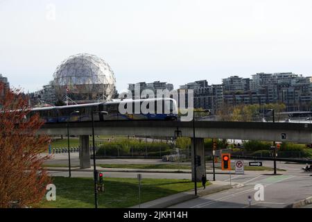 A Sky Train passing Science World Centre in downtown Vancouver, British Columbia, Canada Stock Photo