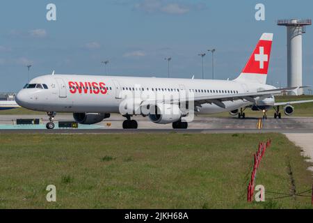 An Airbus A321-111 plane of the Swiss airline moving on the runway to take off at Lisbon airport Stock Photo