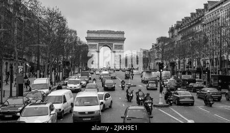 A grayscale shot of the busy Avenue des Champs Elysees in Paris, France Stock Photo