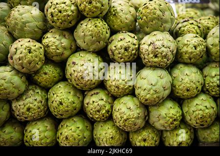 A closeup of fresh artichokes on display at the market in Valencia, Spain Stock Photo