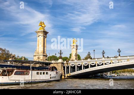 The Pont Alexandre III deck arch bridge spanning the Seine in Paris, France Stock Photo