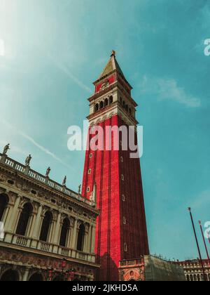 A low angle shot of St Mark's Campanile and Doge Palace in Venice, Italy Stock Photo