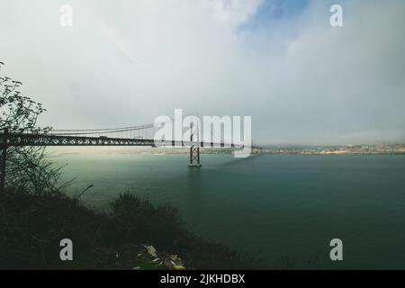 A beautiful view of the Ponte 25 de Abril suspension bridge in Portugal Stock Photo