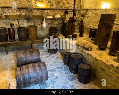 An old style room with decorative barrels in Neamt Citadel, Romania Stock Photo