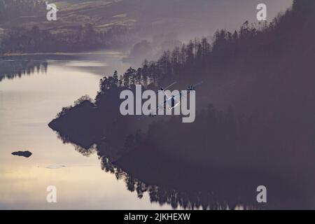 An Airbus A400m Atlas low flying over Thirlmere in the Lake District, the UK Stock Photo