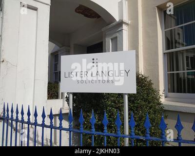 A street sign of the law firm 'Lister Langley solicitors' in Paignton, UK Stock Photo