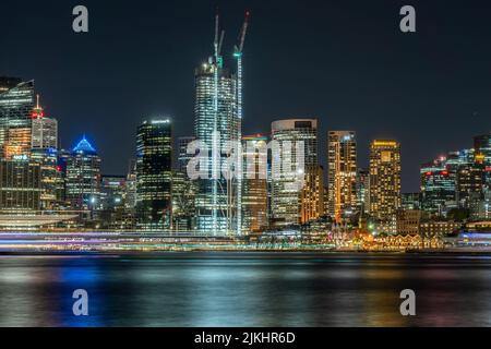 A Panoramic view of skyscrapers and modern buildings against night sky at Sydney Downtown, Australia Banque D'Images