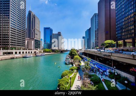 A view of the Chicago River between skyscrapers in the daytime. Stock Photo