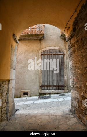 A narrow street among the old stone houses of Taurasi, a medieval town in Avellino province, Italy Stock Photo