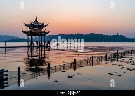 A beautiful view of a West Lake and the pagoda in Hangzhou during the beautiful sunset Stock Photo