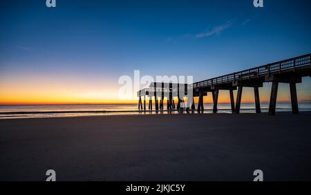 A scenic view of Tybee Island Pier in Georgia at sunset Stock Photo