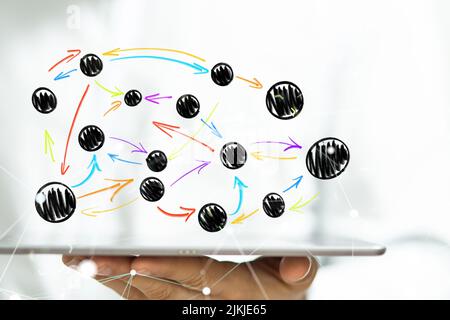 A hologram of interconnected dots projecting from a man's tablet Stock Photo