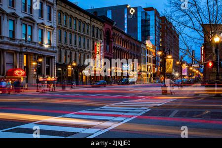 A long exposure shot of car headlights at night on Main Street in Louisville, Kentucky Stock Photo