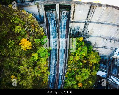 An aerial view of a weathered old dam in the countryside Stock Photo