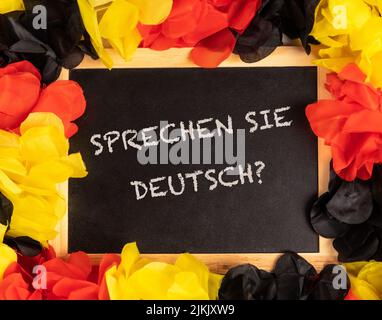 tableau noir de couleurs allemandes et texte allemand spreten sie deutsch, en anglais parlez-vous allemand? Banque D'Images
