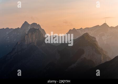 A view of evening light over the Alpstein mountains, photographed from Hoher Kasten. Stock Photo