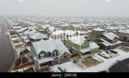 A drone photo of the sprawling suburbs with a foggy sky in the background Stock Photo