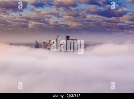 A beautiful shot of the city of Louisville in the clouds with amazing view of the cloudscape on a sunny day, Kentucky, United States Stock Photo