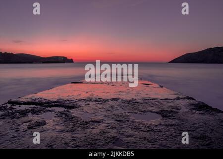 A long exposure shot of a magical sunset at Gorliz beach, Basque Country Banque D'Images