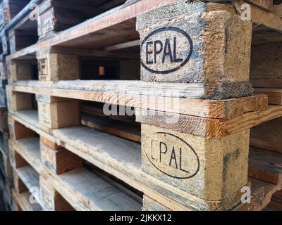 A closeup shot of a stack of used Epal brand wooden pallets in daylight in Spoltore, Italy Stock Photo